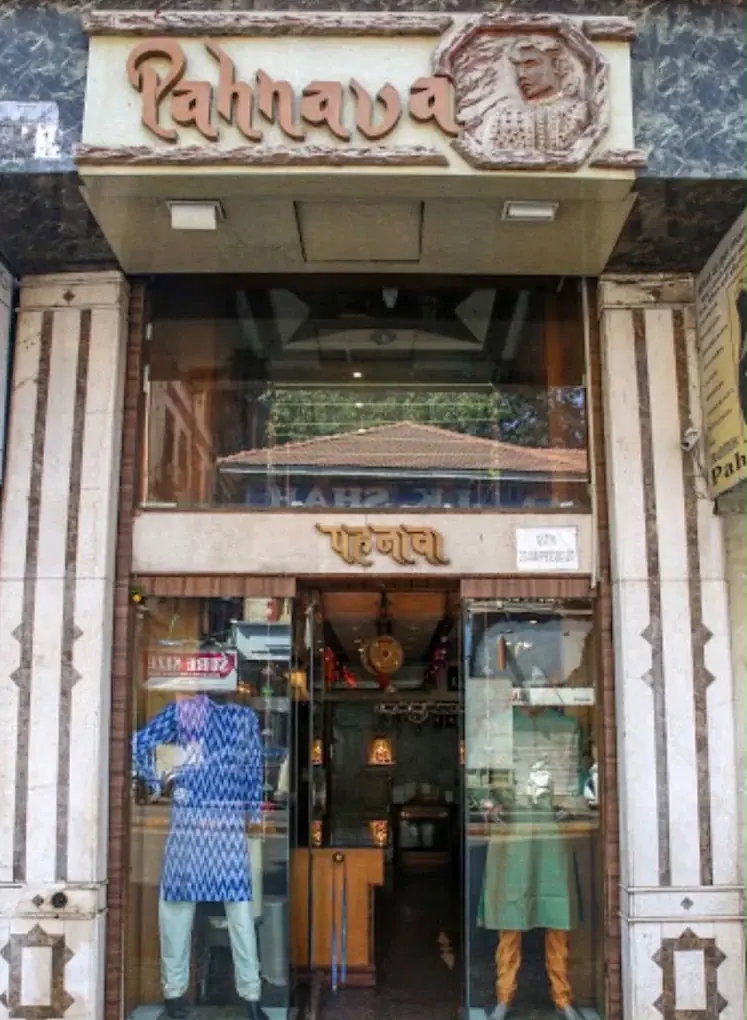 Pahnava shop front with the carved name board and two mannequins in the windows